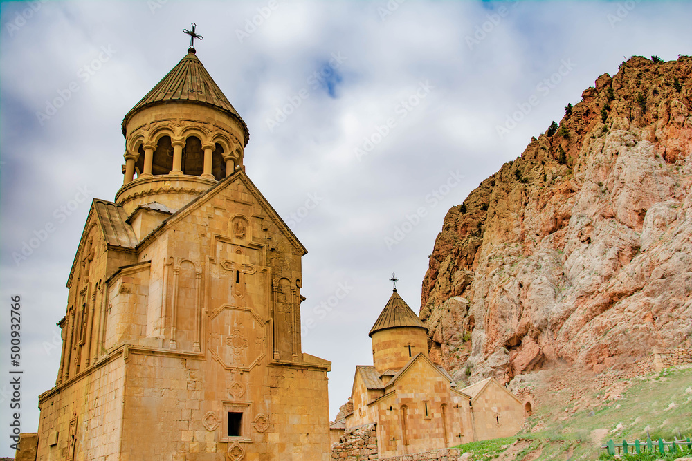 Church surrounded by red rocks. Amazing nature with unique colorful mountains and Noravank Monastery