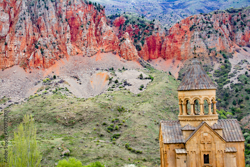 Church surrounded by red rocks. Amazing nature with unique colorful mountains and Noravank Monastery photo