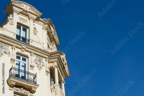 Elegant corner of classical building with different windows and balconies in the centre of Madrid, Spain