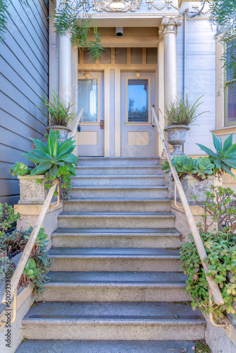 Staircase with plants near the railing at the entrance of a house in San Francisco, California © Jason