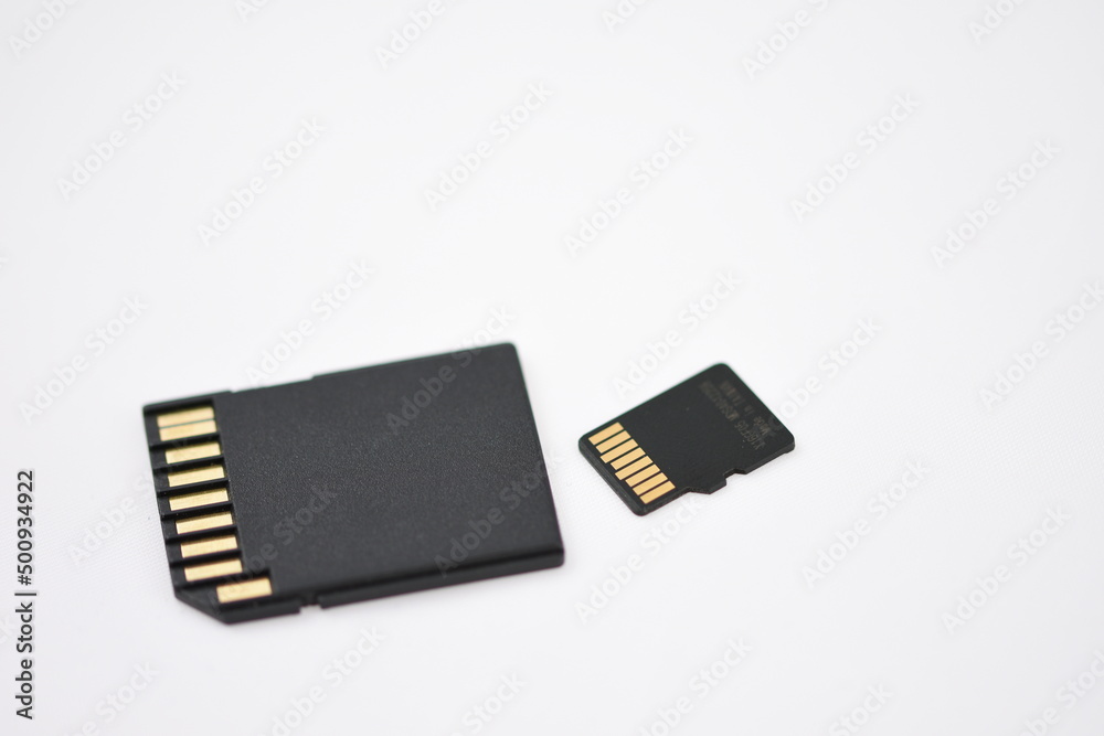 Black microSD memory card and SD card adapter isolated on white Black microSD memory card and SD card adapter isolated on white