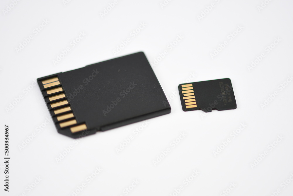 Black microSD memory card and SD card adapter isolated on white Black microSD memory card and SD card adapter isolated on white