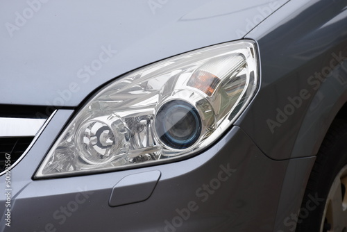 Car's exterior details.Blue car - headlight on gray   car © Laurenx