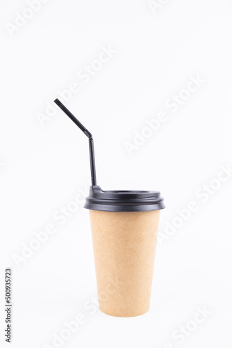 paper cup for coffee with a lid and a straw on a white background