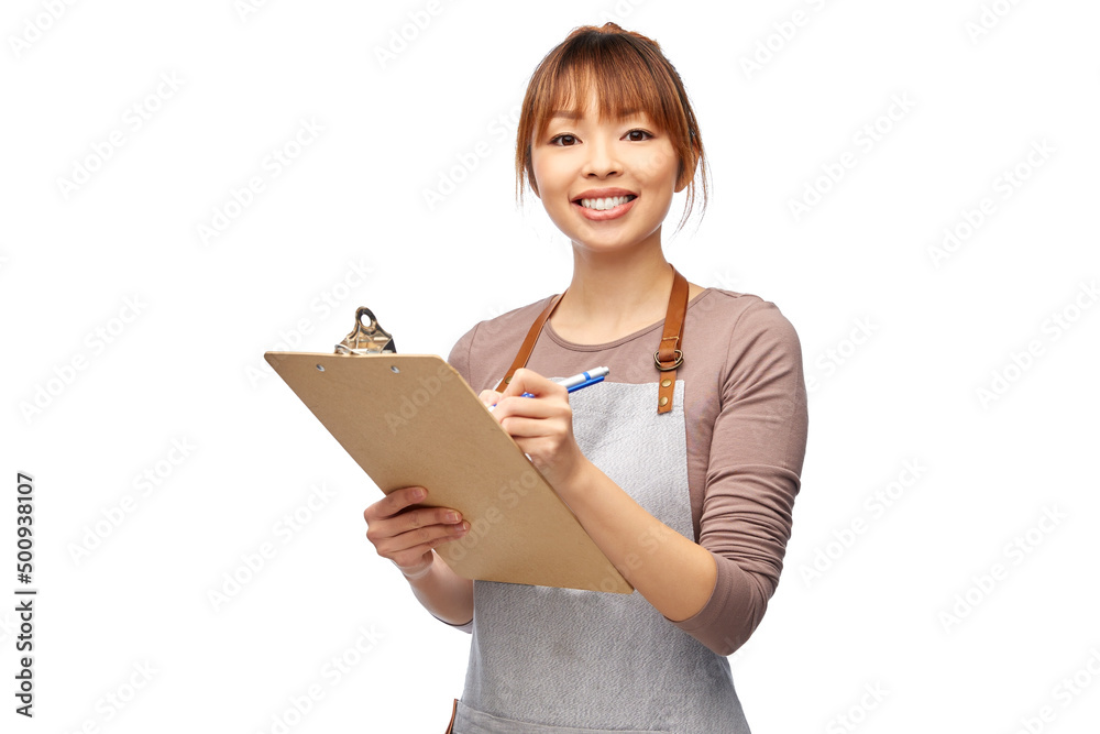 cooking, culinary and people concept - happy smiling female chef or waitress in apron with clipboard and pen writing over white background cooking, culinary and people concept - happy smiling female chef or waitress in apron with clipboard and pen writing over white background