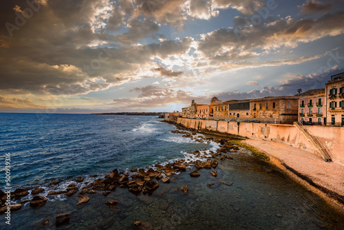 Spectacular sunset over the sea with Maniace Castle