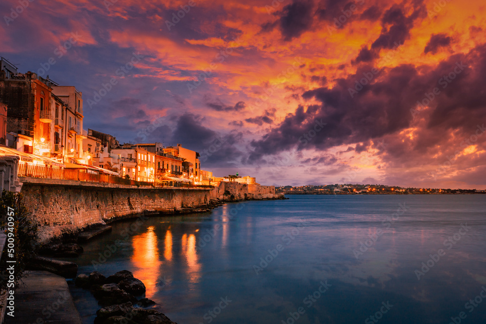 Long exposure of Ortigia with spectacular sunset over the sea