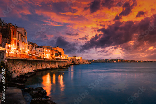 Fototapeta Naklejka Na Ścianę i Meble -  Long exposure of Ortigia with spectacular sunset over the sea