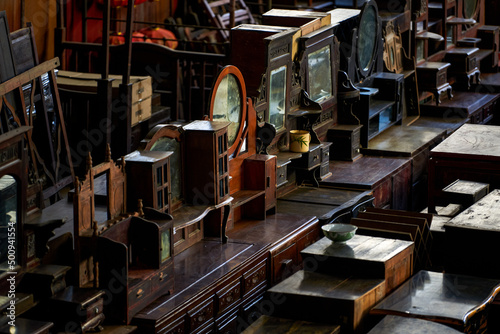 Close-up of furniture placed in a large mahogany furniture store