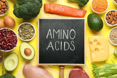 Flat lay composition with products rich in amino acids on yellow background