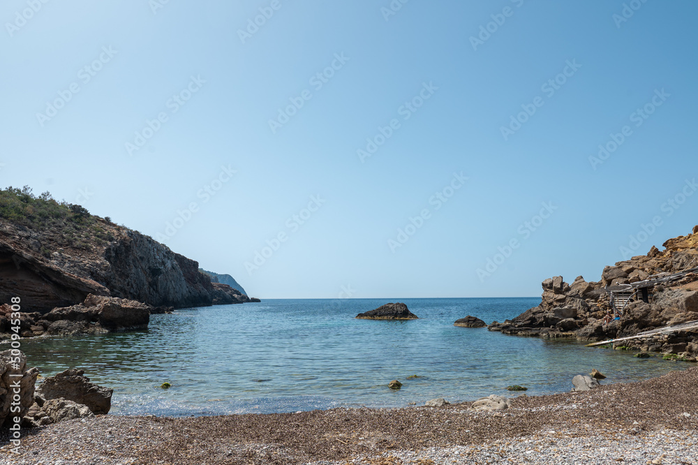 Calo de S Illa beach on the Island of Ibiza in Spain in the summer of 2022