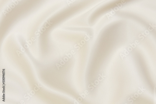 Abstract background texture of natural ivory color fabric. Fabric texture of natural cotton or linen, silk or satin, wool or jersey textile material. Luxurious white canvas background.