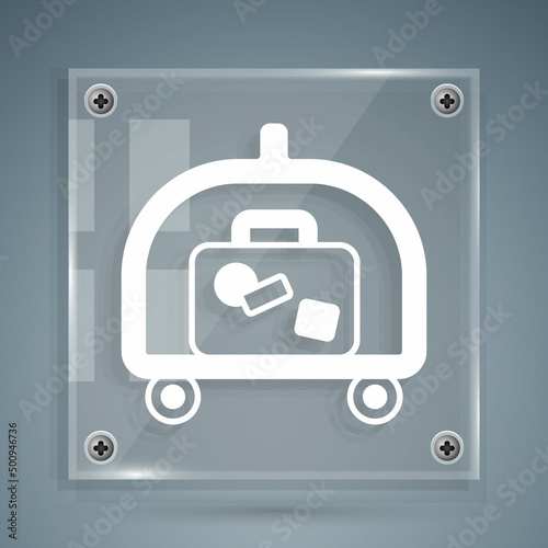 White Hotel luggage cart with suitcase icon isolated on grey background. Traveling baggage sign. Travel luggage icon. Square glass panels. Vector