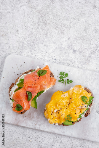 Scrambled eggs with smoked salmon, cream cheese and avocado on toast