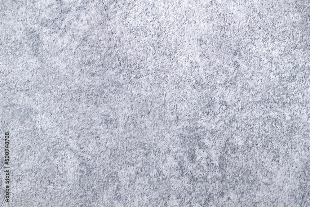 Light background of decorative plaster with abstract spots. Unusual texture of white or gray wall with beautiful patterns, creative surface background. Finishing coating for building cladding. Light background of decorative plaster with abstract spots. Unusual texture of white or gray wall with beautiful patterns, creative surface background. Finishing coating for building cladding.