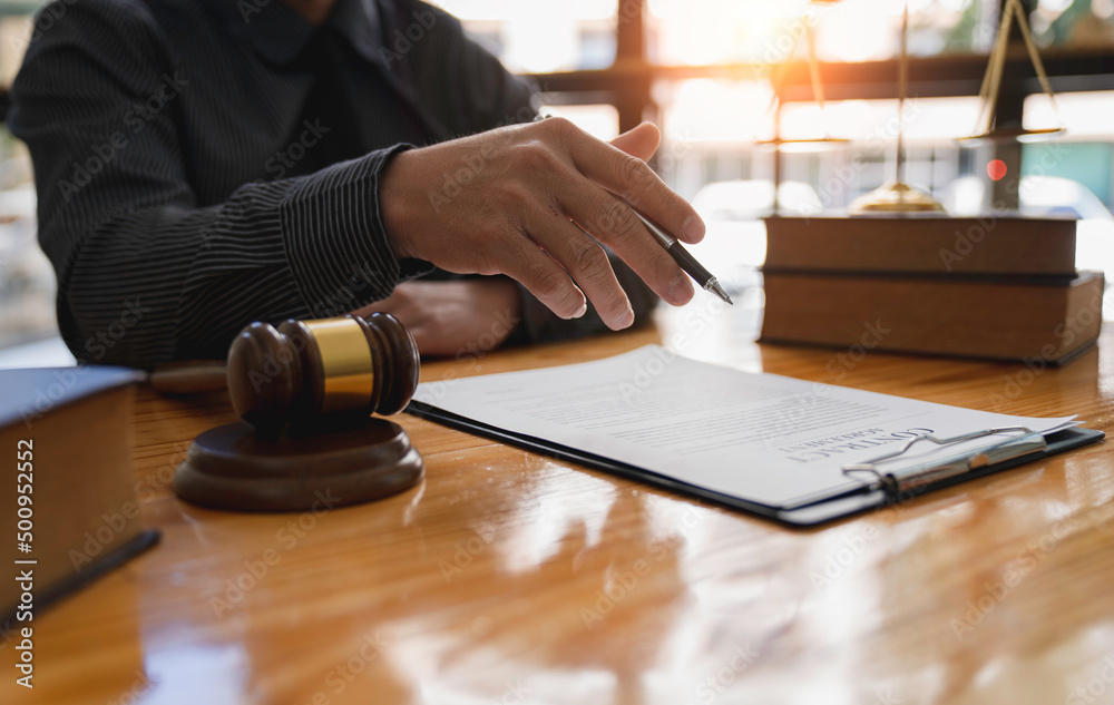 lawyer or judge is giving legal advice. to explaining about consultation terms and conditions to businessmen before signing on contract at a law firm. lawyer or judge is giving legal advice. to explaining about consultation terms and conditions to businessmen before signing on contract at a law firm.
