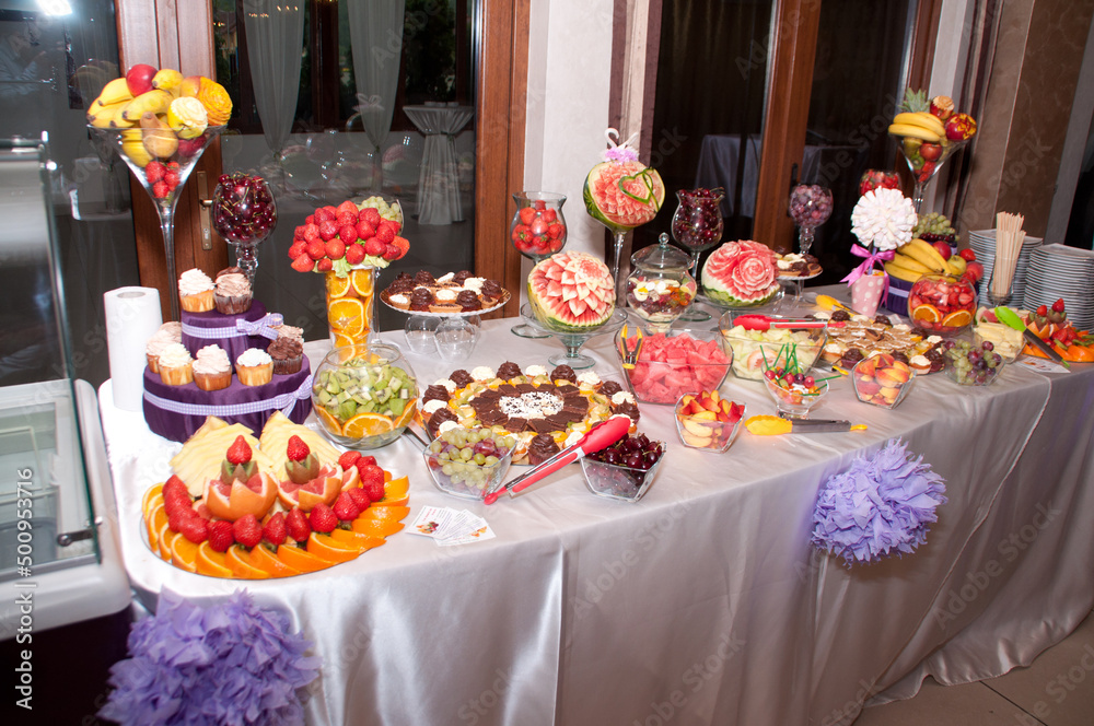 table with  cakes and fruit at  wedding 