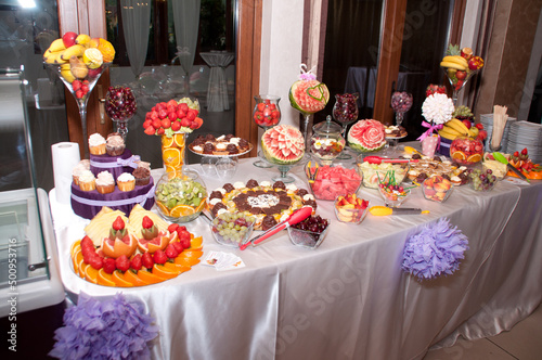 Fototapeta Naklejka Na Ścianę i Meble -  table with  cakes and fruit at  wedding 