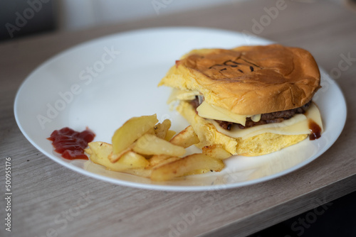 Handmade hamburger with french fries and dips made at home