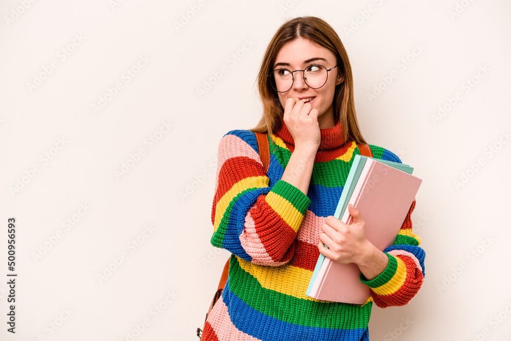 Young student caucasian woman isolated on white background relaxed thinking about something looking at a copy space. Young student caucasian woman isolated on white background relaxed thinking about something looking at a copy space.