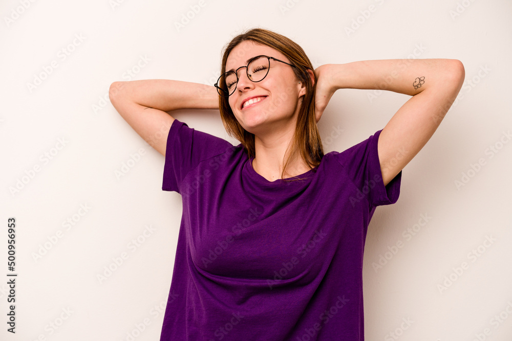 Fototapeta premium Young caucasian woman isolated on white background feeling confident, with hands behind the head.