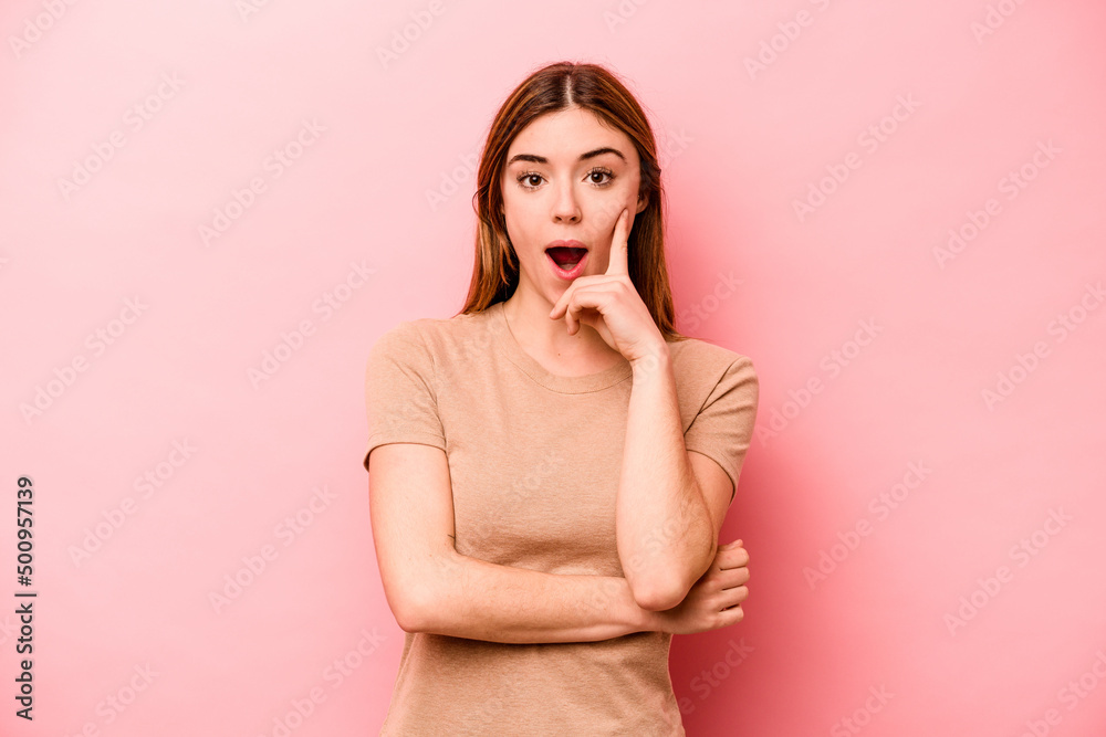 Young caucasian woman isolated on pink background having some great idea, concept of creativity. Young caucasian woman isolated on pink background having some great idea, concept of creativity.