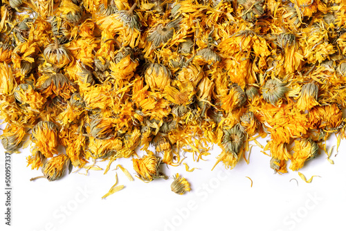 Medicinal flowers of a calendula on white background. Herbal tea. Top view. Close up. High resolution photo