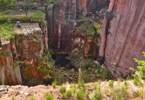 Deep porphyry opencast mining quarry in Rochlitz, Germany.