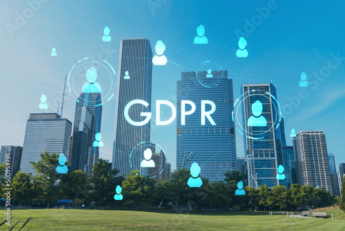 Chicago skyline from Butler Field towards financial district skyscrapers, day time, Illinois, USA. Parks and gardens. GDPR hologram, concept of data protection regulation and privacy for individuals