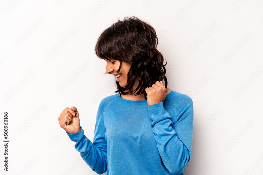 Young hispanic woman isolated on white background dancing and having fun. Young hispanic woman isolated on white background dancing and having fun.