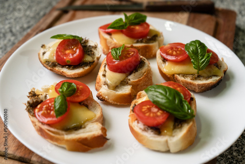 Mediterranean toasts with tomato cheese and basil