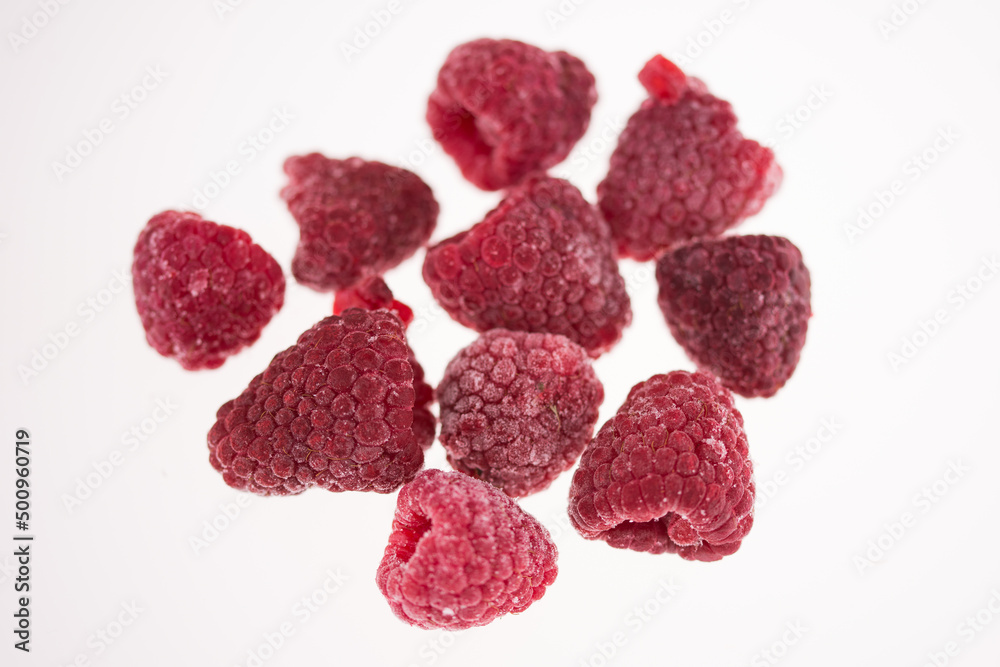 studio photo frozen raspberries on wooden plate studio photo frozen raspberries on wooden plate