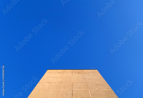 Wall of residential building against sky.