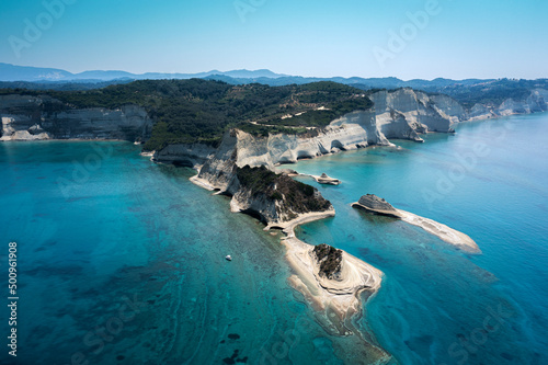 sheer white cliffs of Cape Drastis near Peroulades photo