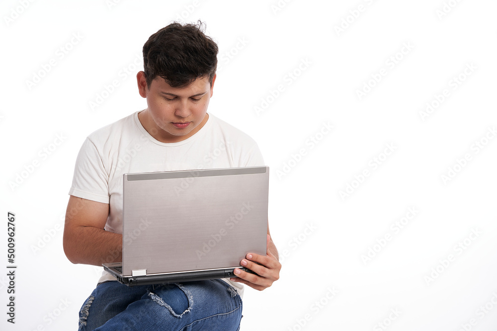 Latin man using his laptop isolated on white background Latin man using his laptop isolated on white background