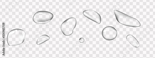 Realistic water drops on a transparent background. Vector