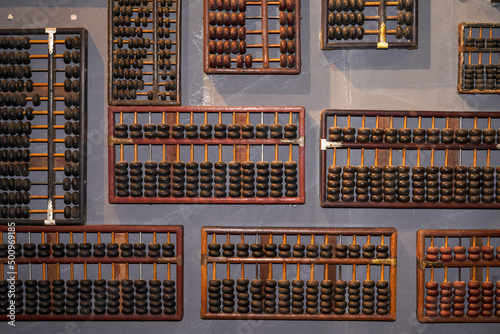 Pile of traditional retro Chinese wooden abacus close-up