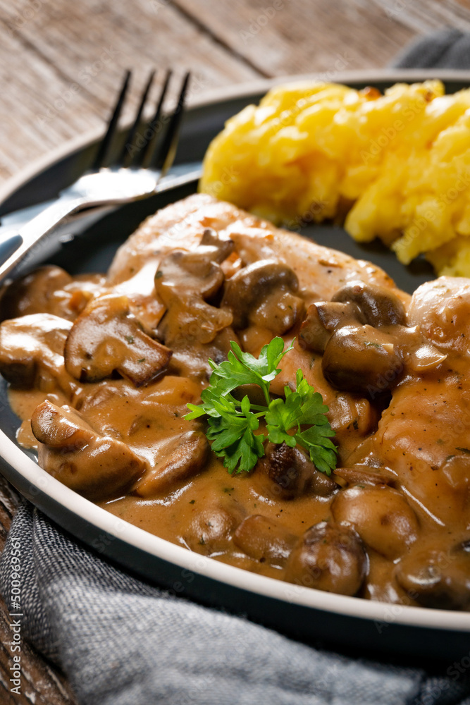 Grilled chicken breast with mushroom sauce.