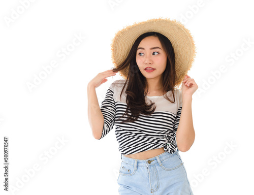 portrait of happy young asian female smiling posing with straw hat in summer dress isolated on white background. Leisure and summer travel concept. © bigy9950