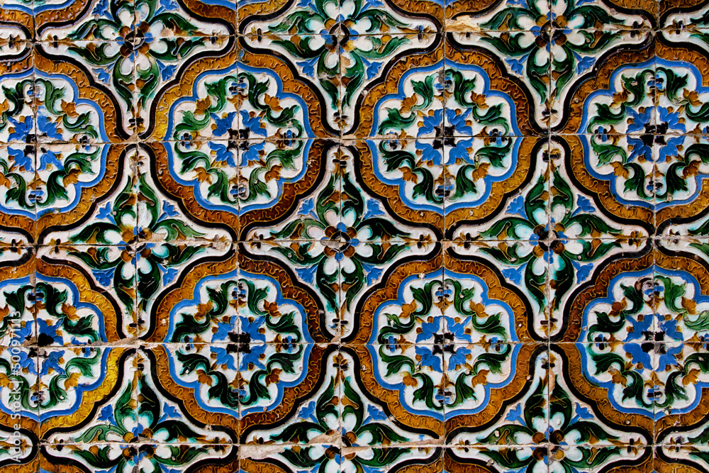 Traditional tiled wall decoration in a city palace in Seville, Spain. Traditional tiled wall decoration in a city palace in Seville, Spain.