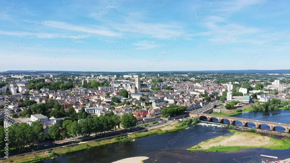The city of Nevers and its bridge on the banks of the Loire, Europe, France, Burgundy, Nievre, in summer, on a sunny day. The city of Nevers and its bridge on the banks of the Loire, Europe, France, Burgundy, Nievre, in summer, on a sunny day.