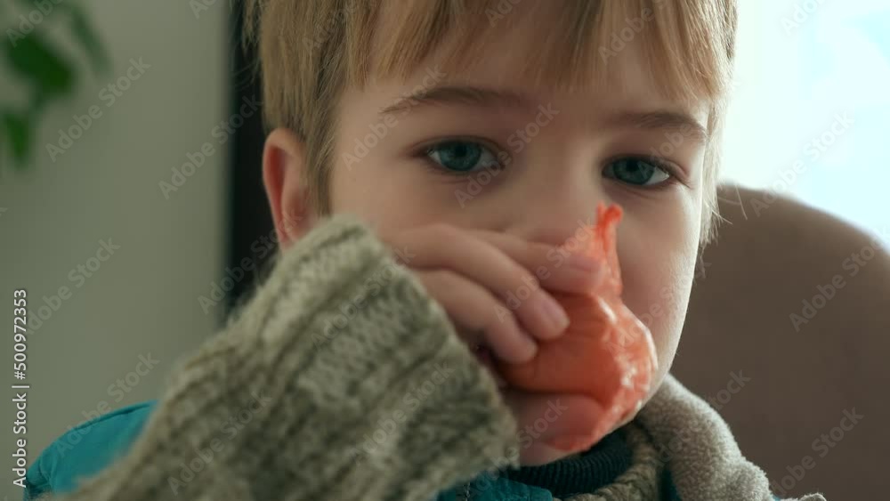 Child Eat Sausage. Kid Eating Meal Breakfast Dinner at Kitchen Table. Boy Wear Warm Sweater Attire Winter Day. Close-up 2x Slow motion 60fps 4K Child Eat Sausage. Kid Eating Meal Breakfast Dinner at Kitchen Table. Boy Wear Warm Sweater Attire Winter Day. Close-up 2x Slow motion 60fps 4K