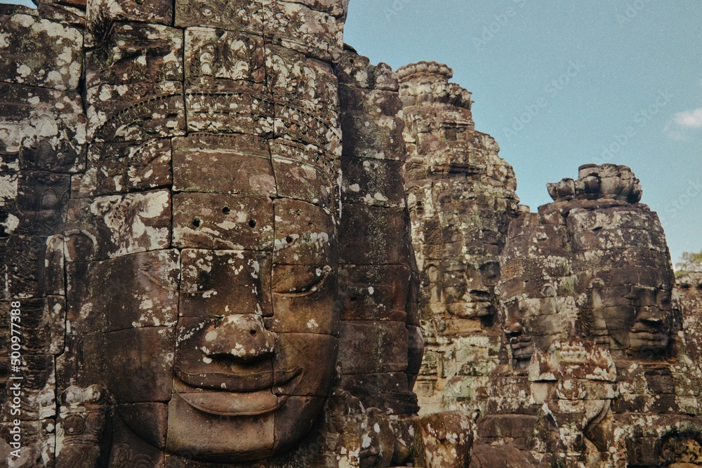 face carved in rock at angkor wat