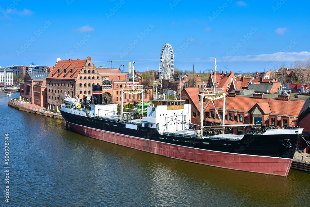 The old town of Gdańsk, a ship on the Motlawa river