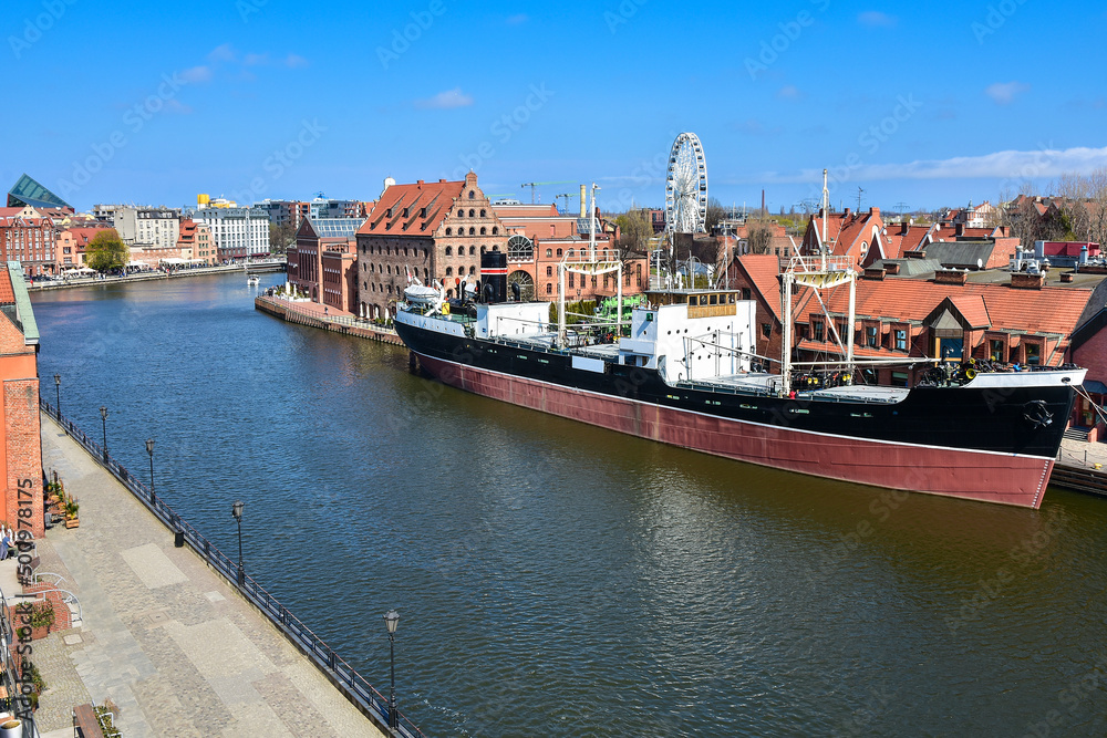 The old town of Gdansk, a ship on the Motlawa rive