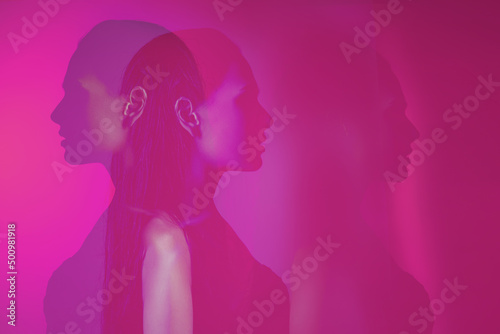 Imagination. bipolar mental disorder. Double face. Split personality. Conceptual mood disorder. Dual personality concept. 2 silhouettes of a female head. mental health. © Julia