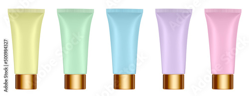 Set of multicolored tubes. 3d mockup. Rainbow palette. Purple, blue, green, yellow and pink colors. Hand cream, mask or lotion. Professional shampoo. Gold cap