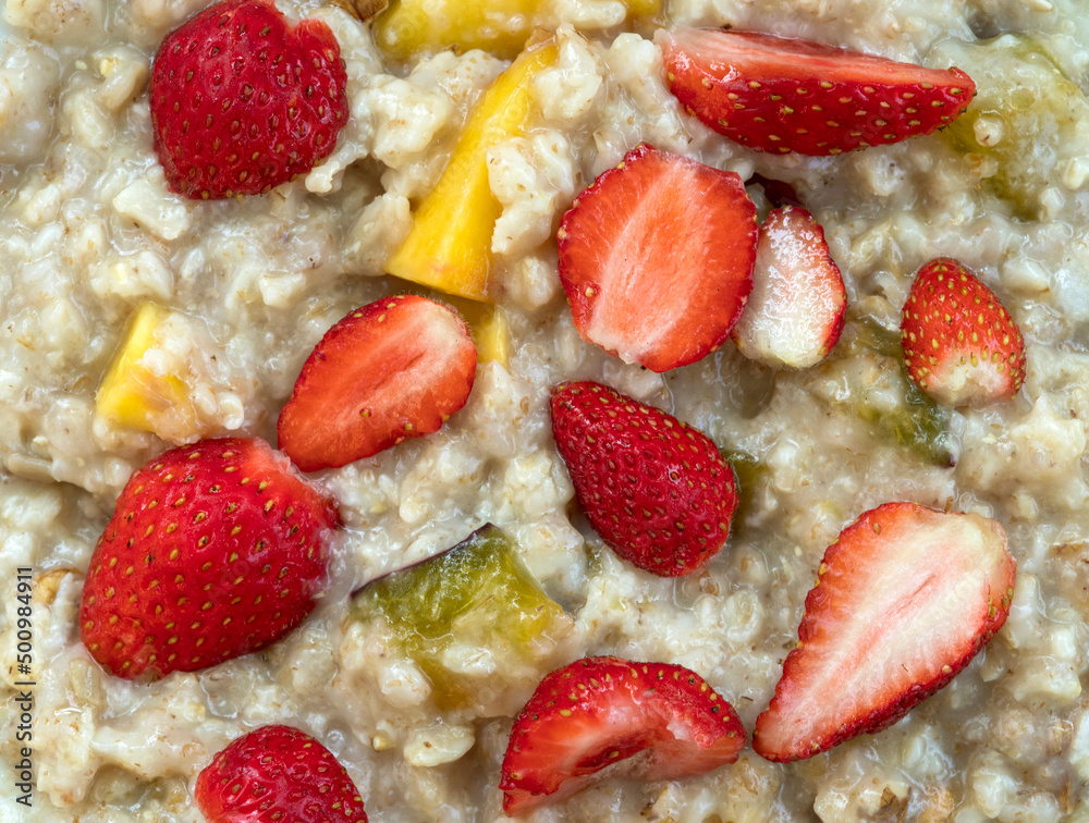 Oatmeal with strawberries, peaches and other fruits. Healthy breakfast. Oatmeal with strawberries, peaches and other fruits. Healthy breakfast.