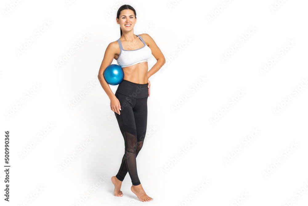 Muscular woman doing core exercises with a medecine ball Muscular woman doing core exercises with a medecine ball