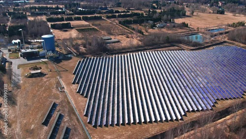 areal view of a large field filled with solar panels, Alternative source photo